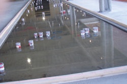 The penetrations required in this depressed area in an elevated floor slab make it difficult to use 10-foot straightedges and riding power trowels. Specifiers should consider these multiple obstructions to finishing operations when determining F-number values. In this case, the specifier required F-numbers in the small depressed floated area that was to receive ceramic tile for bathrooms.