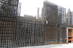 As the photos demonstrate, there are heavily reinforced areas within the shear walls. The beam in the center of the photos has 32 #11 bars, 21 feet long, installed in an “X” pattern across the opening and fully developed into the boundary elements. The design in this location and at the typical boundary elements effectively eliminated the use of internal vibration in much of the walls.