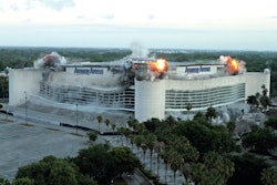 Dykon decided the best approach for demolition would be to blast selected steel roof trusses and the interior concrete seating support columns while leaving the four large corner columns.