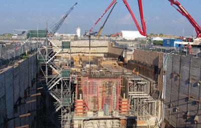 The overall construction process was divided into sections and built in layers rising out of the excavated hole.