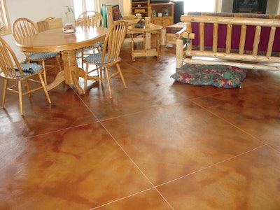 Include photos in your portfolio that demonstrate how your company incorporated cracks, patches and other realistic jobsite elements into a design. In this photo, the contractor incorporated the control joints of the floor into a saw cut pattern to mimic large tiles.