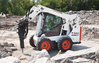 Most manufacturers offer special attachment kits. This Bobcat S570 is equipped with a hydraulic breaker attachment and enclosed cab to protect the operator from debris.