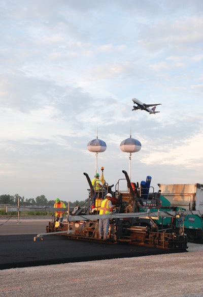 Two Vogele Vision 5200-2 asphalt pavers were used in 24- to 27-ft.-wide passes at the Port Columbus International Airport..