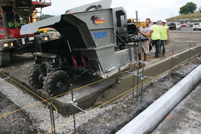 The mid-size curb and gutter machine pours close to the 90-degree transition point.
