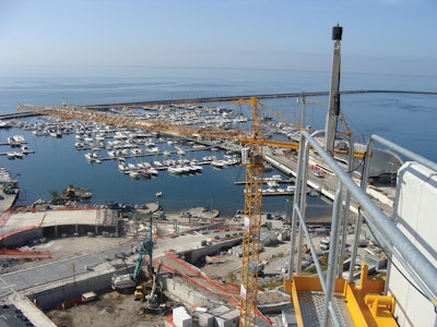 Two of the cranes are working at hook heights of approximately 118 ft. and the third crane operates at a height of approximately 150 ft.