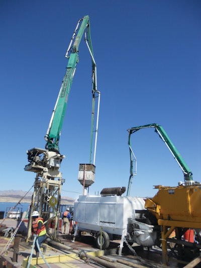 Barge-mounted Putzmeister concrete placing system places 12,000 cu. yds. of concrete underwater to secure a water intake structure for the Third Straw project, which will draw water from the Lake Mead reservoir.