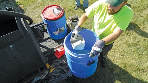 Minus-80 grade crushed recycled glass is added to sealer on the jobsite in place of sand or boiler slag.