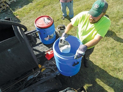 Minus-80 grade crushed recycled glass is added to sealer on the jobsite in place of sand or boiler slag.