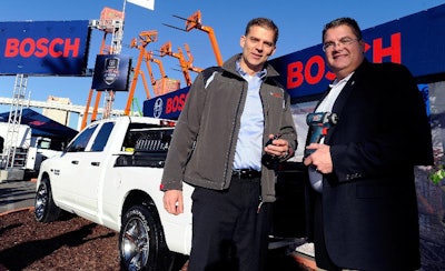 Christian Heine, president, Bosch Power Tools North America (left) and Bob Hegbloom, director, Ram Truck Brand (right), name Ram the 'Official Truck of Bosch Power Tools & Accessories' during the World of Concrete trade show.