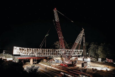 The CC 2500-1 crane lifted the bridge to a height of 33 ft., moved forward 16 ft. under load and swung the bridge into position.