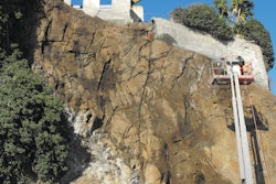 The nozzlemen had to be hoisted more than 60 feet in lifts to spray apply the shotcrete.