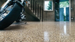 A high-gloss finish on this exposed-aggregate showroom floor adds light reflectivity, one of the environmentally friendly benefits of polished concrete.