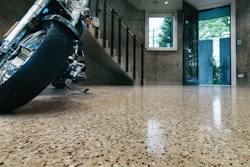 A high-gloss finish on this exposed-aggregate showroom floor adds light reflectivity, one of the environmentally friendly benefits of polished concrete.
