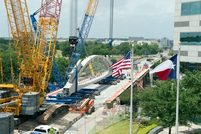 Within the arch, there is a network of stainless steel hangers with clevises and tie-beam connections that protect pedestrians from traffic on the bridge while allowing both motorists and pedestrians to enjoy a nearly unobstructed view of the river.