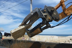 The Mega Beak allows OBPM Construction to precisely pick apart a house or concrete slab and crush the material into more manageable pieces for loading into dumpsters.