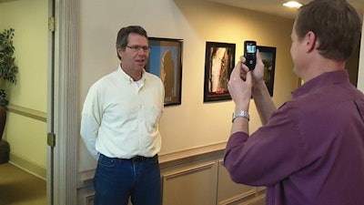 Doug Herbert records a video testimonial from a customer.