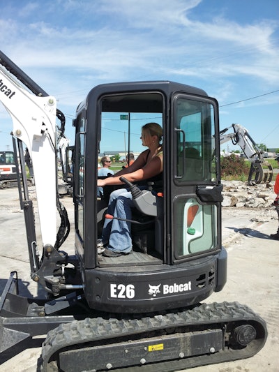 New Assistant Editor Jessica Stoikes operates an E26 Excavator at the Bobcat Attachments Boot Camp in Fargo, ND