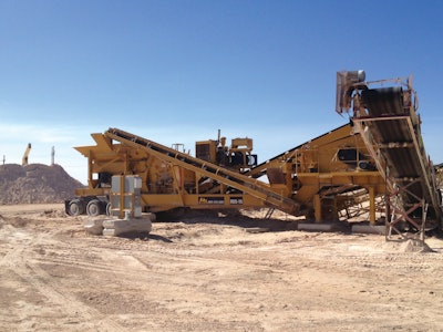 A concrete pile in the distance soon to be crushed and screened by the RDS-15, which will process the stack into several grades of usable material.