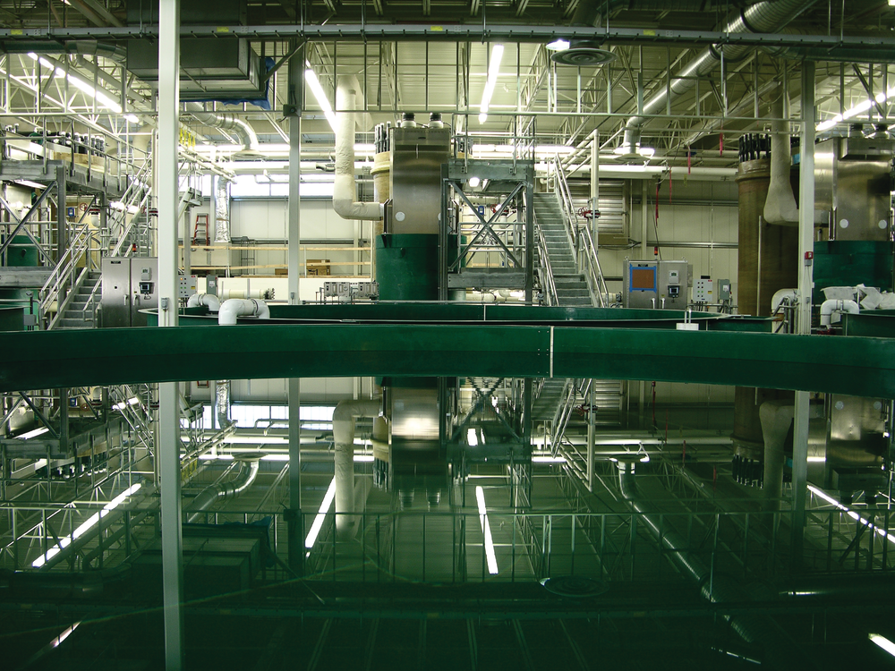 The hatchery&rsquo;s completed fish tanks are 28 feet in diameter and 8 feet deep. Used in groupings of two or three, the tanks comprise the largest area inside the hatchery. Due to the intensive water reuse and treatment recirculating process, the tanks only use 50 gpm of makeup water while circulating 1,000 gpm through the tank group.