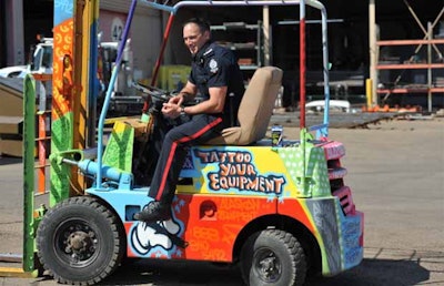 Acting Sgt. Trevor Henderson with a painted forklift that would be easy to identify. The Edmonton Police service launched the 'Tattoo your equipment' campaign to curb the theft of heavy equipment in Edmonton. In west division alone EPS investigates about a dozen thefts a month.