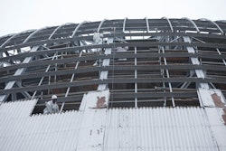 NCM used scaffolding to reach the hangar’s curved walls. As one section of the exterior was removed, NCM would remove the scaffolding and reassemble it in the next location while working simultaneously on other sections.