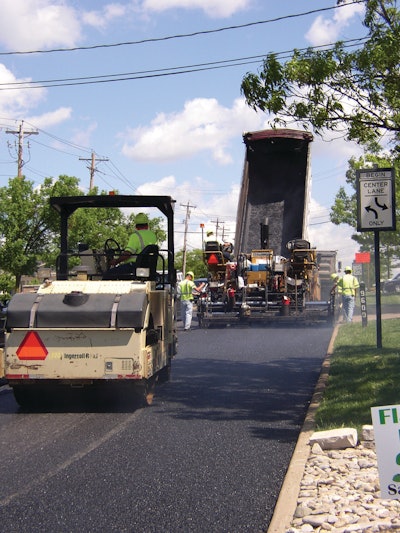 The key to compaction success after the mix has been placed is to roll the mat while it is still hot, so it's important the roller follow close behind the paver.