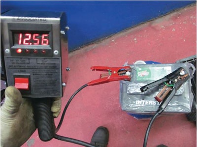 When the tester's clamps are placed on the battery, it automatically displays the battery's voltage.