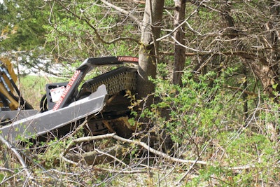 Scott Wolf uses a Bradco Ground Shark Extreme-Duty brush cutter (such as the one shown) to clear trails through 700 acres of heavy hardwoods in Muenster, TX.