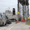 Two sets of portable traffic signals had to work in conjunction with the bridge's existing traffic control system to keep road traffic flowing during shipping season.