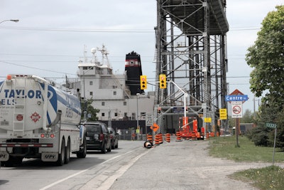 Two sets of portable traffic signals had to work in conjunction with the bridge's existing traffic control system to keep road traffic flowing during shipping season.