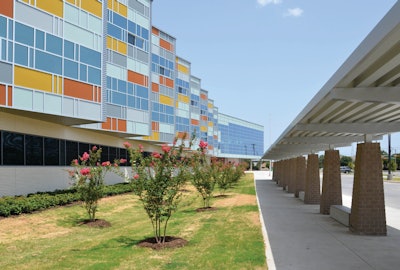 The outside facade of the Billy Earl Dade Middle School in Dallas, Texas, which opened on time and under budget thanks in part to a new rapid-drying concrete technology.