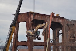 The demolition work was done from the top down, so the equipment had to be lifted 80 feet off the ground to the top of the dock.