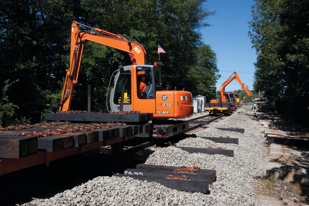 Three Trains of Excavators Rebuilds Commuter Railway Ahead Three Trains of Excavators Rebuilds Commuter Railway Ahead