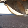 Compaction of a fine-graded asphalt pavement, one of several pavement types addressed in The World Road Association's Quiet Pavement Technologies report.