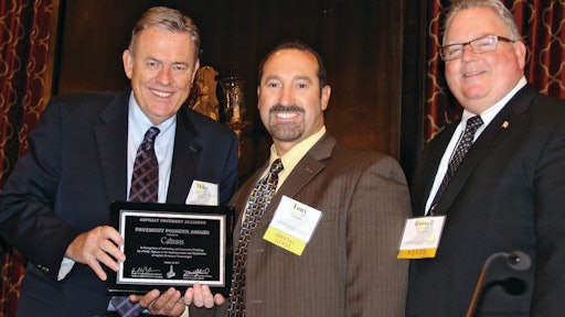 National Asphalt Pavement Association President Mike Acott (left) and California Asphalt Pavement Association Executive Director Russell Snyder (right) present the Pavement Pioneer Award to Caltrans Maintenance Chief Tony Tavares.