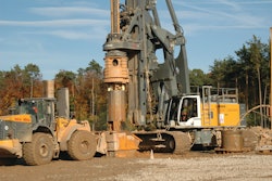 A drill bucket is used to loosen and remove the drill cuttings.