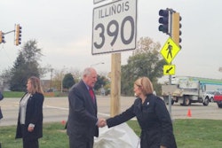 A sign displaying the new name of the Elgin-O'Hare Expressway, Illinois Route 390, was unveiled after the official ground-breaking ceremony. (Pictured from left: Illinois Tollway Executive Director Kristi Lafleur, Governor Pat Quinn, and IDOT Transportation Secretary Ann Schneider.)