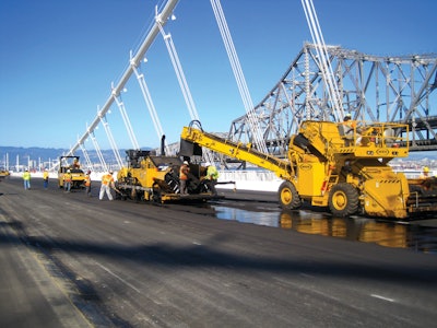 The Weiler E1250A RTV helped the paving train move continuously and consistently.