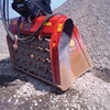 In some areas of the settling pond, previously excavated material is being mixed with a binding agent using two ALLU Screener Crushers.