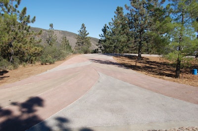 The finished pervious concrete driveway included five different integral colors to match the colors of the house on the property.