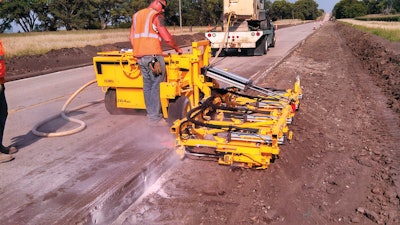 The E-Z Drill 210-4SRA 4-gang Slab Rider was modified to achieve a maximum of 33-in. spacing for drilling tie bar holes along the shoulder of Nebraska 92. The modified drill doubled Chester Boss' drilling productivity over the 2-gang models.