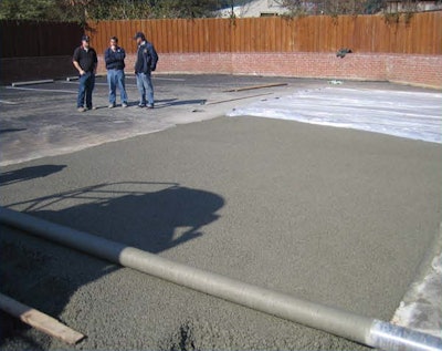 Finishing the pervious concrete was done with roller-screed strike-off, covered with plastic and rolled, and then received a plastic cover cure.