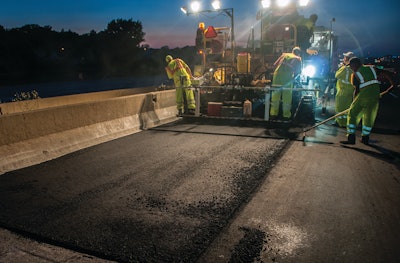 The total job required 75,000 tons of E10 Superpave HMA to be laid 3 ½ inches thick and compacted to 92 percent. Paving widths varied from 12 to 16 feet depending on whether it was lane, shoulder or places where lanes merged.