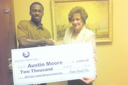 As the recipient of the WSA 2013 Carl J. Austin Memorial Scholarship, Austin Moore accepts a $2000 check from Marilyn E. Reineck, Ph.D., Sr. Vice President for Academics, Concordia University Chicago. Austin's father, Rod Moore, is the general manager for C&J Parking Lot Sweeping, a WSA member, so the scholarship was doubled to $2,000.