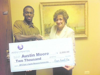 As the recipient of the WSA 2013 Carl J. Austin Memorial Scholarship, Austin Moore accepts a $2000 check from Marilyn E. Reineck, Ph.D., Sr. Vice President for Academics, Concordia University Chicago. Austin's father, Rod Moore, is the general manager for C&J Parking Lot Sweeping, a WSA member, so the scholarship was doubled to $2,000.