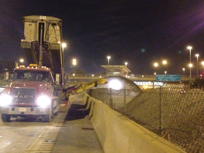 The work on the tracks and the adjacent area needed to be completed without disturbing the walls and fences, which meant the ballast had to be 'pitched' over the safety/security structures, required by the Illinois Department of Transportation.