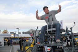 David Ray, from Molzahn Construction in Worland, Wyo., celebrates winning Wacker Neuson's Trowel Challenge -- a riding-trowel obstacle course the company has held during the past six World of Concrete shows.