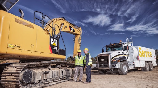 Cat Dealer Technician Consults With Equipment Manager