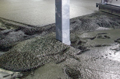 Shown here is a two-list concrete placement. The first lift is placed and laser-screeded (shown at the bottom right). The top lift, concrete with synthetic macro fibers and admixtures, is placed within minutes afterwards.