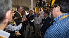 Doug Oberhelman, Caterpillar chairman and CEO, talks with visitors to Cat's CONEXPO 2014 exhibit.